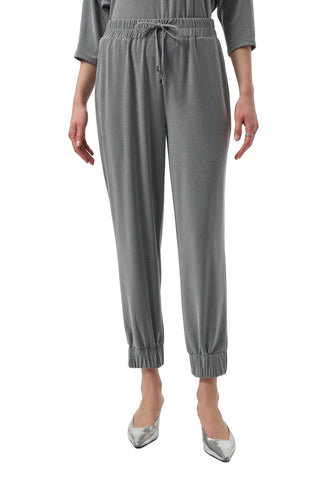 Gray jumpsuit worn by a person on a white background