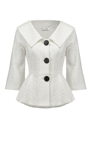 White textured blazer with black buttons on a white background