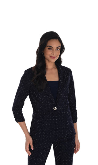 Woman wearing a navy polka dot suit with 'Frank Lyman Montreal' branding.