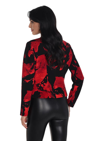 Woman wearing a red and black floral patterned jacket on a white background