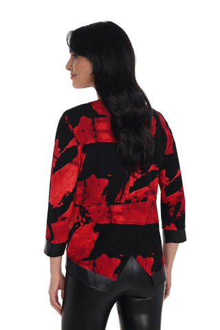 Woman wearing a red and black patterned top on a white background