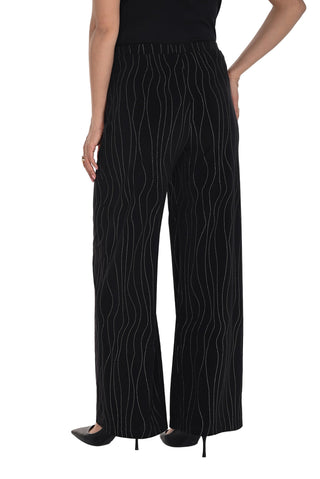 Black pants with white line pattern worn by a person on a white background