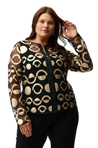 Woman wearing a black and beige patterned jacket on a white background
