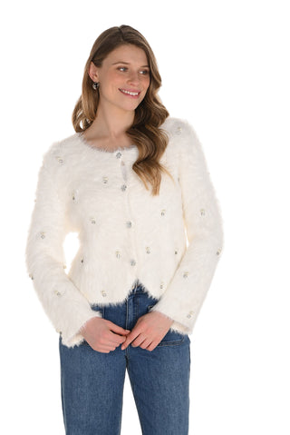 Woman wearing a white fluffy cardigan with buttons on a white background