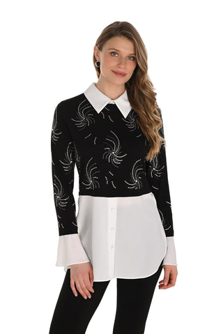 Woman wearing a black and white patterned top with a white collar on a white background