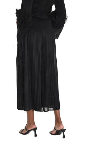 Black dress with ruffled sleeves on a white background