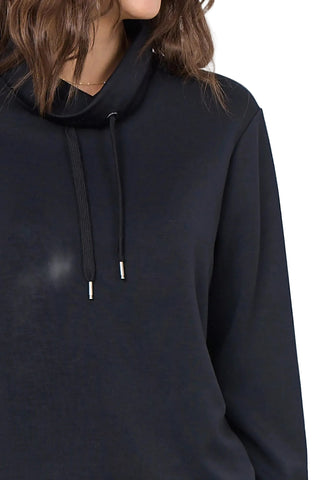 Navy mock neck top with white background.