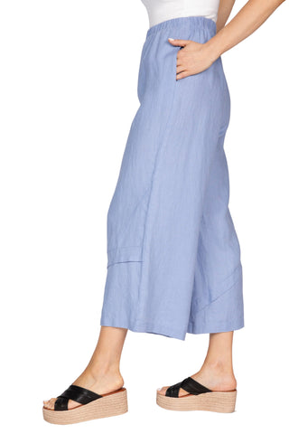 Light blue wide-leg pants worn by a person on a white background