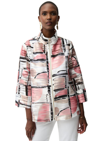 Woman wearing a colorful abstract-patterned jacket on a white background