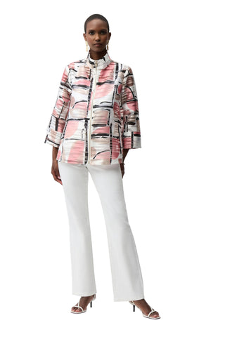 Person wearing a patterned jacket and white pants on a white background