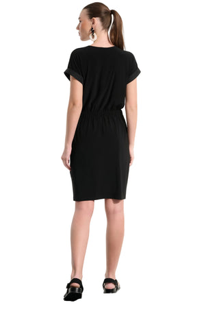 Woman wearing a black dress on a white background