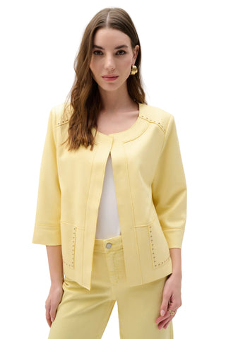 Woman wearing a light yellow suit on a white background
