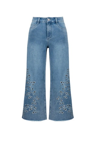 Blue jeans with floral embroidery on a white background
