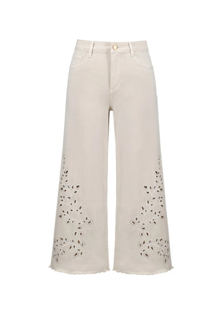 White pants with black speckles on a white background
