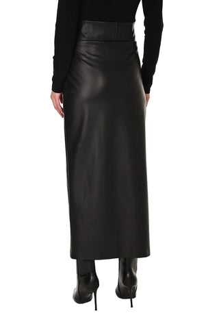 Black leather skirt worn by a person on a white background
