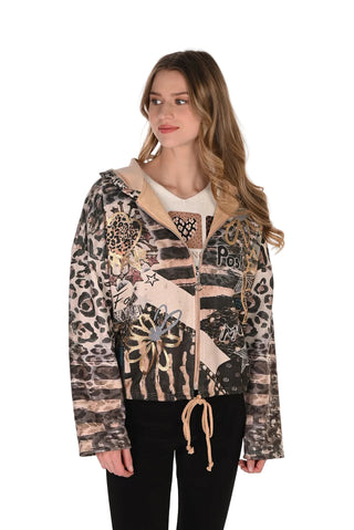 A woman modeling a mixed animal print hooded jacket with leopard, zebra, and tiger patterns in beige, brown, and black, featuring a beige hood lining and a drawstring waist, paired with a white top and black pants against a white background.