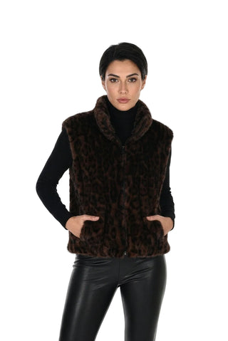 Woman wearing a brown fur vest with a white background