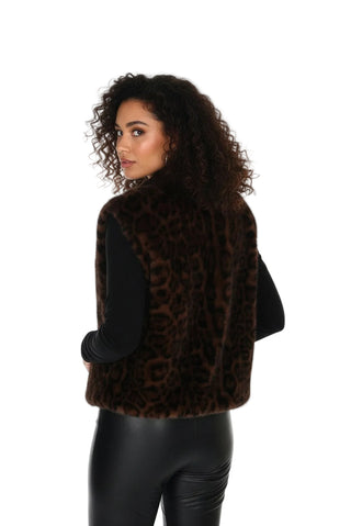 Woman wearing a leopard print vest on a white background