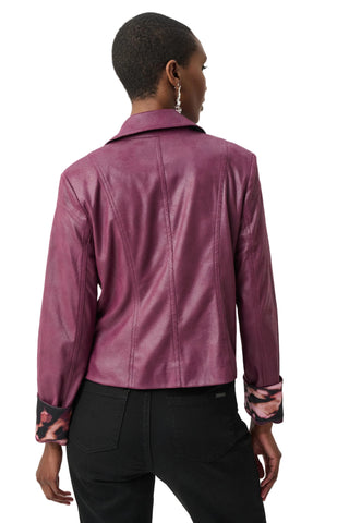 Person wearing a purple leather jacket on a white background