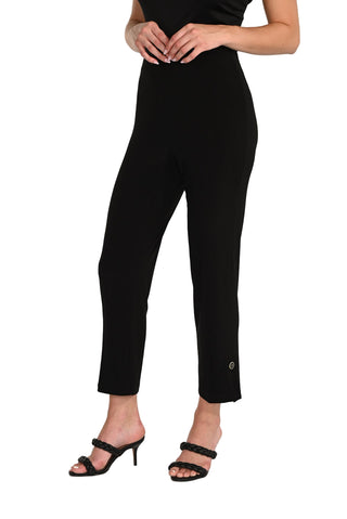 Person wearing a black jumpsuit on a white background