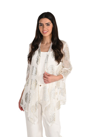 Woman wearing a white embroidered outfit on a plain background