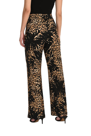 Leopard print pants worn by a person on a white background