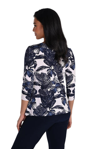 Woman wearing a floral blouse with a white background