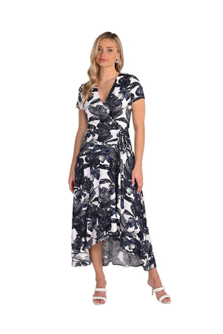 Woman wearing a black and white floral dress on a white background