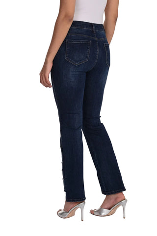 Dark blue jeans worn by a person on a white background