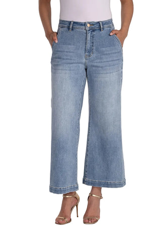 Person wearing light blue jeans on a white background