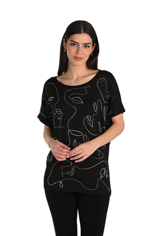 Woman wearing a black t-shirt with white abstract designs on a white background
