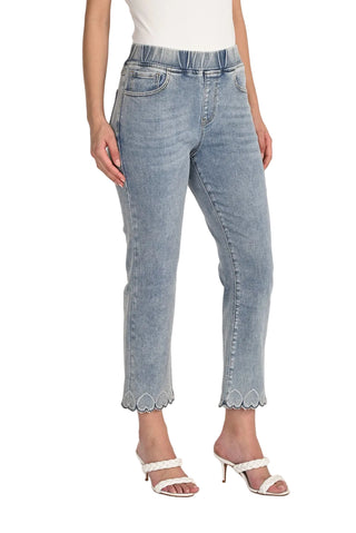 Light blue jeans with scalloped hem worn by a person on a white background