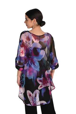 Woman wearing a floral blouse with a white background