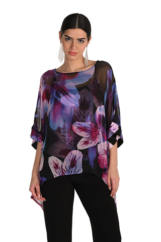 Woman wearing a floral blouse with a white background