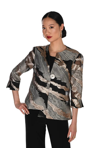 A woman modeling a metallic jacquard blazer with a marbled pattern in silver, bronze, and black, paired with black pants against a plain white background.