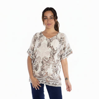 Woman wearing a patterned shirt on a white background