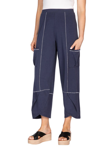 Navy blue pants with white piping worn by a person on a white background