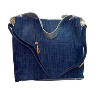 Blue denim handbag on a white background