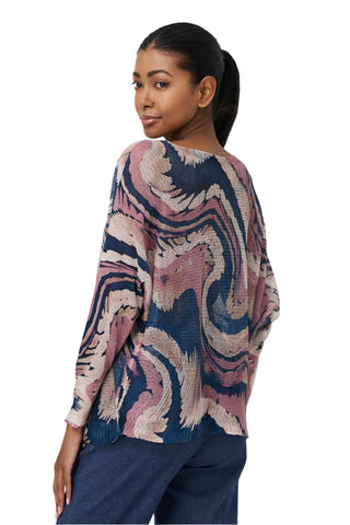 Woman wearing a patterned sweater on a white background