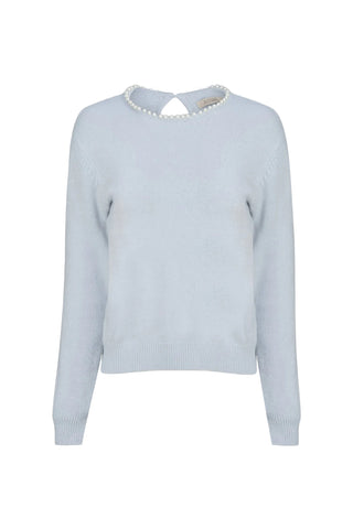 A light blue knit sweater with a decorative collar featuring a row of white pearls, displayed against a solid off-white background.
