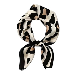 Leopard print headband on a white background