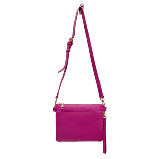 Pink handbag with a strap on a white background