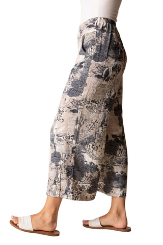 Patterned pants worn by a person on a beige background