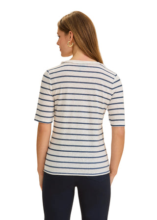 Woman wearing a striped shirt on a beige background