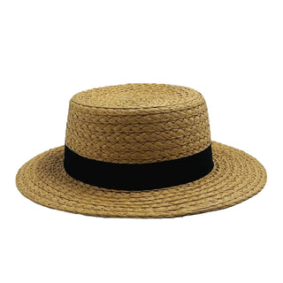 Beige straw hat with a black band on a light gray background