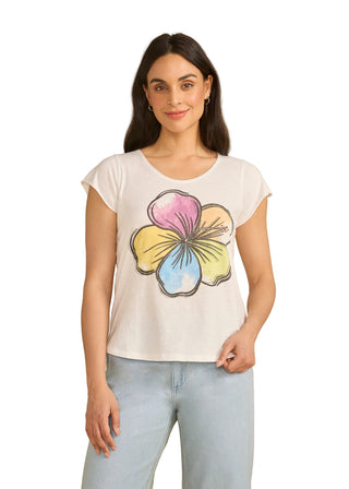Woman wearing a white t-shirt with a colorful flower design on a beige background