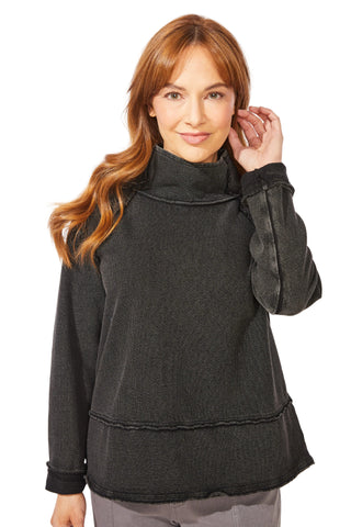 Woman wearing a black pullover with a white background