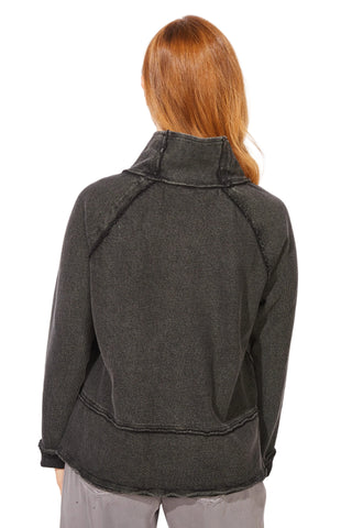 Person wearing a dark gray jacket on a white background