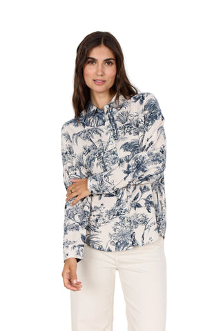 Woman wearing a floral blouse with a white background