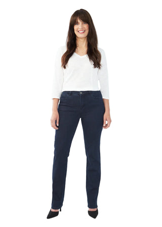 Woman wearing navy pants and a white top on a white background